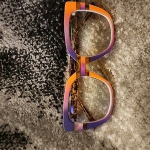Colorful, vibrant women's eyeglasses. Pink, purple, and orange.